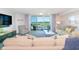 Bright living room with comfortable seating, balcony access and scenic views at 2151 Bridge View Ct. # 2-902, North Myrtle Beach, SC 29582