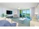 Spacious living room with modern decor, comfortable sofas, and a large sliding glass door to the balcony at 2151 Bridge View Ct. # 2-902, North Myrtle Beach, SC 29582