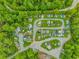 Aerial view of boat storage area surrounded by lush green landscaping and mature trees at 2166 Marion Circle, Little River, SC 29566