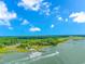 Aerial view of the waterway and community boat with lush green landscaping and mature trees at 2166 Marion Circle, Little River, SC 29566