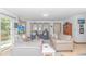Bright living room with ample seating, hardwood floors, and access to the outdoors at 2166 Marion Circle, Little River, SC 29566