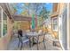 The patio is appointed with modern outdoor furniture, a grill, and a pergola with outdoor lighting at 2166 Marion Circle, Little River, SC 29566