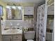 Cozy bathroom with a decorative seashell theme, vanity sink, and a shower with a seashell curtain at 2204 S Perrin Dr. # 3, North Myrtle Beach, SC 29582