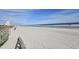 Relaxing beach view with a sandy shoreline, calm ocean, and blue sky at 2204 S Perrin Dr. # 3, North Myrtle Beach, SC 29582