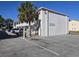 White, two-story condo building with stair access and a paved parking lot at 2204 S Perrin Dr. # 3, North Myrtle Beach, SC 29582