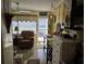 Relaxing sunroom with a comfortable recliner, bright lighting, and a view of the outdoors at 2204 S Perrin Dr. # 3, North Myrtle Beach, SC 29582