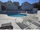 Community pool surrounded by lounge chairs with clear blue water at 2204 S Perrin Dr. # 3, North Myrtle Beach, SC 29582