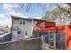 View of the home's backyard with a red fence and a wood deck at 306 Cedar St. # Apt 12, Myrtle Beach, SC 29577