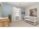 Charming Bedroom with whimsical wallpaper, wooden crib, and a modern aesthetic at 402 Clear Lake Dr., Conway, SC 29526