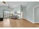 Bright living room featuring a comfortable sofa, neutral paint, and wood-look flooring at 4231 Rivergate Ln., Little River, SC 29566