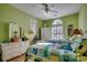 Bright bedroom with twin beds, ceiling fan, and white wicker furniture showcases a comfortable space at 48 Heston Ct., Pawleys Island, SC 29585