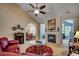 Inviting living room features a cozy fireplace and sophisticated decor, with seamless transitions to adjacent rooms at 48 Heston Ct., Pawleys Island, SC 29585