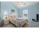 Bright bedroom features vaulted ceilings, ceiling fan, and beach-themed decor at 6001- 5411 S Kings Highway, Myrtle Beach, SC 29575