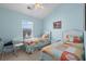 Bedroom featuring two beds, a window and light blue walls at 6001- 5411 S Kings Highway, Myrtle Beach, SC 29575