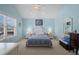 Bedroom featuring vaulted ceiling, large window and light blue walls at 6001- 5411 S Kings Highway, Myrtle Beach, SC 29575