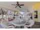 Covered deck with wicker table, ceiling fans, providing a comfortable outdoor living space at 6001- 5411 S Kings Highway, Myrtle Beach, SC 29575