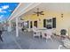 Inviting covered deck featuring a table, chairs, and a grill, perfect for outdoor dining and entertaining at 6001- 5411 S Kings Highway, Myrtle Beach, SC 29575