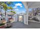Covered deck featuring gray flooring, white railings, an outdoor lift and views of neighboring houses at 6001- 5411 S Kings Highway, Myrtle Beach, SC 29575