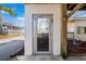 Exterior elevator access with glass door and white siding, offering convenience and accessibility at 6001- 5411 S Kings Highway, Myrtle Beach, SC 29575