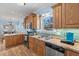 Bright kitchen with stainless steel appliances and ample counter space by a window at 6001- 5411 S Kings Highway, Myrtle Beach, SC 29575