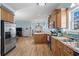 Spacious kitchen with stainless appliances and an island flowing into the dining area at 6001- 5411 S Kings Highway, Myrtle Beach, SC 29575