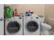 Laundry room featuring white washer and dryer units and a nearby toilet at 6001- 5411 S Kings Highway, Myrtle Beach, SC 29575