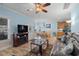 Living and dining area featuring modern light fixture, a large TV, and comfortable seating at 6001- 5411 S Kings Highway, Myrtle Beach, SC 29575