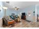 Open living area with a ceiling fan, television, and a door with decorative wreath at 6001- 5411 S Kings Highway, Myrtle Beach, SC 29575