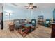 Comfortable living room featuring a gray sofa, two armchairs, and light blue walls at 6001- 5411 S Kings Highway, Myrtle Beach, SC 29575
