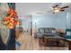 Open-concept living room with hardwood floors, comfortable seating, and seamless flow to the kitchen at 6001- 5411 S Kings Highway, Myrtle Beach, SC 29575