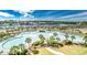 Aerial view of a pool area, palm trees, a marina, and waterfront buildings at 6015 Catalina Dr. # 734, North Myrtle Beach, SC 29582