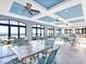 Spacious dining area features ocean views, light tile floors and modern ceiling fans at 6015 Catalina Dr. # 734, North Myrtle Beach, SC 29582