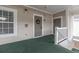 Inviting unit entrance with a decorative wreath, secured door, and exterior lighting fixture at 6015 Catalina Dr. # 734, North Myrtle Beach, SC 29582