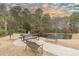 Picturesque picnic area with a table, benches, grill, and scenic pond with fountain at 6015 Catalina Dr. # 734, North Myrtle Beach, SC 29582