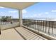 Spacious balcony overlooking the beach with railings and plenty of room for outdoor seating and relaxation at 6200 N Ocean Blvd. # 101, North Myrtle Beach, SC 29582