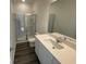 Modern bathroom featuring a glass-enclosed shower, toilet, and sleek vanity with ample counter space at 647 Castillo Dr., Loris, SC 29569
