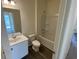 Sparkling bathroom with a modern vanity, toilet, and a shower-tub combo at 647 Castillo Dr., Loris, SC 29569
