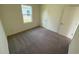 Comfortable carpeted bedroom bathed in natural light from a window and featuring a spacious closet at 647 Castillo Dr., Loris, SC 29569