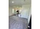 Inviting carpeted living room that seamlessly flows into a modern kitchen with sleek appliances and ample counter space at 647 Castillo Dr., Loris, SC 29569