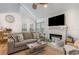 Living room showcasing a fireplace, comfortable seating, and a vaulted ceiling at 717 41St Ave. S, North Myrtle Beach, SC 29582