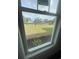 Window view of a lush backyard with a tranquil pond at 740 Jade Dr., Myrtle Beach, SC 29579