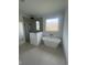 Bathroom with modern standalone tub, shower stall and bright window at 740 Jade Dr., Myrtle Beach, SC 29579