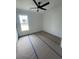 Bright bedroom with ceiling fan and window view of a pond at 740 Jade Dr., Myrtle Beach, SC 29579