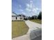 Concrete driveway leading to a lovely home with a well-maintained lawn in a desirable neighborhood at 740 Jade Dr., Myrtle Beach, SC 29579