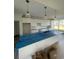 Bright kitchen with white cabinets, an island, and modern pendant lighting at 740 Jade Dr., Myrtle Beach, SC 29579