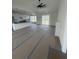 Open-concept kitchen and living room with a modern fireplace and sliding glass doors at 740 Jade Dr., Myrtle Beach, SC 29579