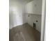 Neat laundry room with overhead white cabinets and tile floor at 740 Jade Dr., Myrtle Beach, SC 29579