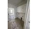 Neat laundry room with overhead white cabinets and tile floor at 740 Jade Dr., Myrtle Beach, SC 29579