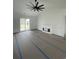 Spacious living room with modern fireplace, fan and sliding glass doors to the backyard at 740 Jade Dr., Myrtle Beach, SC 29579