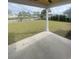 Covered patio with scenic view of the lawn and pond at 740 Jade Dr., Myrtle Beach, SC 29579